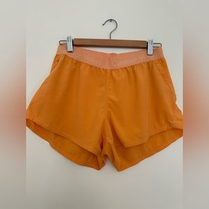 outdoor voices hudson short in orange - size medium